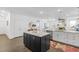 Bright kitchen features a center island with a stone countertop and modern appliances, perfect for Gathering and entertaining at 176 Clearblue Loop, Summerville, SC 29486