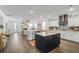 Open kitchen with white cabinets, an island, and stainless steel appliances at 176 Clearblue Loop, Summerville, SC 29486