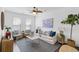 Bright living room with modern decor, stylish furnishings, and a ceiling fan at 176 Clearblue Loop, Summerville, SC 29486