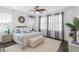 Serene primary bedroom with a ceiling fan, providing a tranquil retreat with ample natural light and neutral decor at 176 Clearblue Loop, Summerville, SC 29486