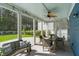 Relax on this covered patio with a ceiling fan and views of the fenced backyard at 176 Clearblue Loop, Summerville, SC 29486