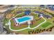 Aerial view of the community pool, playground, parking and putting green surrounded by native landscaping at 184 Grange Cir, Summerville, SC 29486
