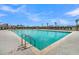 View of a large community pool featuring lounge chairs, picnic umbrellas, and pristine cool water at 184 Grange Cir, Summerville, SC 29486