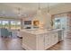 Open kitchen concept with bar stool seating, large island, and living room view at 184 Grange Cir, Summerville, SC 29486