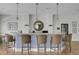 Clubhouse bar with woven stools, granite countertop, stainless-steel microwave, and light pendants above at 2014 Basildon Rd, Mount Pleasant, SC 29466