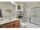 Clean bathroom featuring a wood vanity, shower over tub, and neutral tones creating a bright space at 2014 Basildon Rd, Mount Pleasant, SC 29466