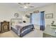 Comfortable bedroom with a wrought iron bed frame, soft blue accents, ample natural light, and stylish decor at 2014 Basildon Rd, Mount Pleasant, SC 29466