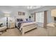 Bright bedroom with a white wooden bed, coastal-themed decor, and soft carpet for a relaxing ambiance at 2014 Basildon Rd, Mount Pleasant, SC 29466