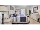 Bright bedroom with tasteful nautical decor, neutral walls, and a comfortably decorated bed at 2014 Basildon Rd, Mount Pleasant, SC 29466