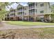 Exterior of apartment building with well-maintained landscaping, balconies, and inviting curb appeal at 2014 Basildon Rd, Mount Pleasant, SC 29466