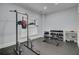 Well-equipped gym area with pull-up station, weight bench, dumbbells and rubber floor at 2014 Basildon Rd, Mount Pleasant, SC 29466