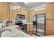 Kitchen featuring stainless steel appliances, wood cabinetry, and light countertops at 2014 Basildon Rd, Mount Pleasant, SC 29466