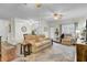 Cozy living room featuring a neutral color palette, plush sofas, ceiling fan, and an open floor plan to dining area at 2014 Basildon Rd, Mount Pleasant, SC 29466