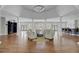 Elegant lounge area with comfortable seating, hardwood floors, and ample natural light for relaxation and socializing at 2014 Basildon Rd, Mount Pleasant, SC 29466