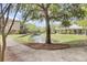Scenic view of the community pond and fountain surrounded by lush landscaping and walking paths at 2014 Basildon Rd, Mount Pleasant, SC 29466