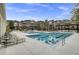 Community swimming pool featuring a shallow end, lounge chairs, palm trees, and condo buildings at 2014 Basildon Rd, Mount Pleasant, SC 29466
