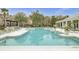 Community swimming pool boasts multiple sections, lounge chairs, landscaped surroundings, and nearby condos at 2014 Basildon Rd, Mount Pleasant, SC 29466