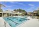 Inviting community swimming pool features separate sections, lounge chairs, clubhouse, and manicured landscaping at 2014 Basildon Rd, Mount Pleasant, SC 29466