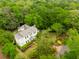 Aerial view of a two-story home surrounded by trees and lush green landscape at 2158 Westrivers Rd, Charleston, SC 29412