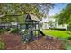 A backyard featuring a play set, a grass area, and an exterior view of the home at 2158 Westrivers Rd, Charleston, SC 29412
