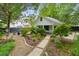 Backyard featuring a gravel walkway leading to a patio with outdoor seating and lush garden at 2158 Westrivers Rd, Charleston, SC 29412