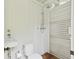 A quaint bathroom with a toilet, standup shower, and sink at 2158 Westrivers Rd, Charleston, SC 29412