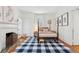 Bedroom features a four poster bed, fireplace, and multiple bright windows for lots of natural light at 2158 Westrivers Rd, Charleston, SC 29412