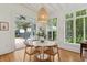 Inviting dining area with round table, hardwood floors, and French doors that open to a patio at 2158 Westrivers Rd, Charleston, SC 29412
