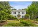 Attractive traditional home with neat landscaping, mature trees, and a well-maintained front garden at 2158 Westrivers Rd, Charleston, SC 29412