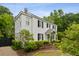 Side view of a two-story home, showcasing the facade and surrounding landscaping at 2158 Westrivers Rd, Charleston, SC 29412
