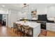 Elegant kitchen with a large island, seating, stainless steel appliances, and hardwood floors at 2158 Westrivers Rd, Charleston, SC 29412