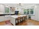 Modern kitchen with a large marble island, black countertops, and counter seating at 2158 Westrivers Rd, Charleston, SC 29412