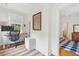 Bright office with a standing desk, ergonomic chair, and a neutral sisal rug at 2158 Westrivers Rd, Charleston, SC 29412