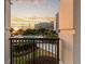 Condo balcony features wrought iron, landscaping, and view of the pool and bridge at 222 S Plaza Ct, Mount Pleasant, SC 29464