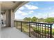 Condo balcony features wrought iron, landscaping, with a view of the bridge at 222 S Plaza Ct, Mount Pleasant, SC 29464
