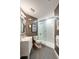 Modern bathroom with glass enclosed shower, white vanity, and gray tile floor at 222 S Plaza Ct, Mount Pleasant, SC 29464