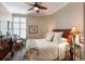 Cozy bedroom featuring a ceiling fan, plantation shutters, and comfortable furnishings at 222 S Plaza Ct, Mount Pleasant, SC 29464
