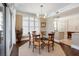 Bright dining room features a modern light fixture and is connected to an open floor plan at 222 S Plaza Ct, Mount Pleasant, SC 29464