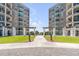 Stunning view between two buildings featuring an outdoor courtyard with manicured lawn and brick paved entry at 222 S Plaza Ct, Mount Pleasant, SC 29464