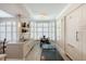 Bright kitchen features a breakfast nook with plantation shutters and white cabinets with modern appliances at 222 S Plaza Ct, Mount Pleasant, SC 29464