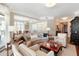 Open-concept living room features modern finishes, neutral tones, and an abundance of natural light at 222 S Plaza Ct, Mount Pleasant, SC 29464