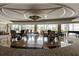 Elegant lobby showcasing seating area with stylish chairs, piano, and ample natural light through large windows at 222 S Plaza Ct, Mount Pleasant, SC 29464