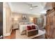 Spacious main bedroom featuring hardwood floors, tray ceiling, and stylish furnishings at 222 S Plaza Ct, Mount Pleasant, SC 29464