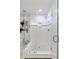 Modern shower featuring glass doors, tiled walls, and rainfall showerhead at 222 S Plaza Ct, Mount Pleasant, SC 29464
