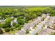 Scenic aerial view of a residential neighborhood featuring a pond, tree-lined streets, and well-maintained homes at 2254 Show Basket Way, Mount Pleasant, SC 29466
