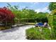 Back patio with seating amongst lush landscaping at 2254 Show Basket Way, Mount Pleasant, SC 29466