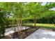 Manicured landscaping surrounds a large patio with pavers that provides an outdoor space for enjoyment at 2254 Show Basket Way, Mount Pleasant, SC 29466