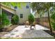 Well-maintained backyard patio featuring stone tile flooring, lush greenery, and comfortable seating at 2254 Show Basket Way, Mount Pleasant, SC 29466