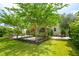 Expansive backyard with well-maintained lawn, stone patios, and mature landscaping at 2254 Show Basket Way, Mount Pleasant, SC 29466