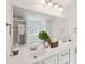 Bright bathroom featuring double sinks, a large mirror, and modern fixtures at 2254 Show Basket Way, Mount Pleasant, SC 29466